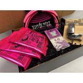 The Ernie Ball & D'Addario Pink Guitar Player Gift Bundle